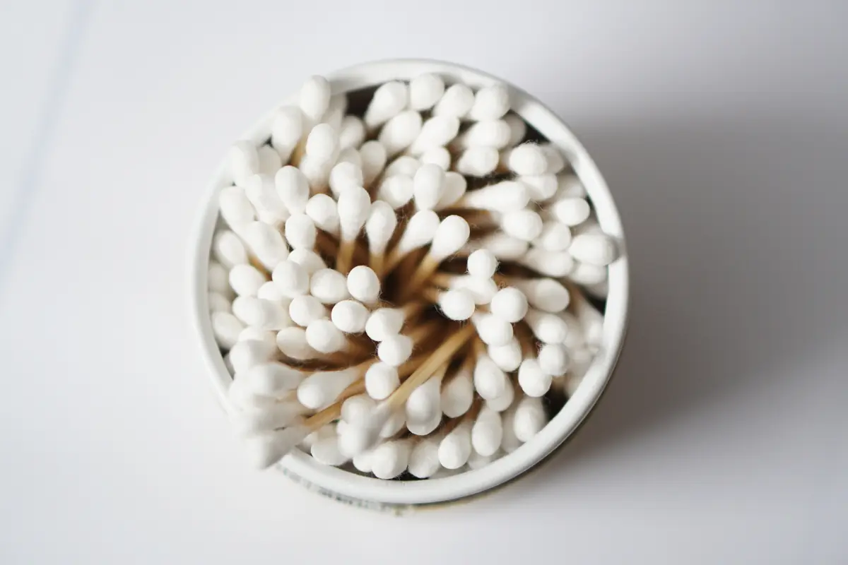 Container filled with cotton swabs